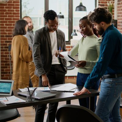 Diverse group of coworkers planning research analysis in business office, working on startup partnership to create project report with charts data and statistics. Using documents and digital tablet. SSUCv3H4sIAAAAAAAAA01STY/cIAz9L5wHNXzDHPfQW6XeVz0YMDNoM8kokK5Wo/z3OvPRlgPC9vPzw/aN1cyOTMQSUGngaHTiWqXMwUbNkzdOCW+CE4kdWIaO7CiUGswgvfTWeDfQObAIrSZ2vLE6jmvrC/Q6T+xIkQWnjMv9ibn2eakwkrUdWOvQ14aN0shKxH2i6N1+8b3fdj8JfFtbnbC1b9/rBFNCEtPWSIGfOF9HZNvhhXw6XvEftSUcR5hwXtt/sL8Atv06MDjhlL52IduueES463pn4EocHCKHWArX0SrukfpktVQhDc7KpIjKB1Woc5ZHyJprUQwHurkU0gUXo3XaEcxmbZwInssEiutBDtwHR71WTsgcJYhcCGYKFRI682SISJvoOXi6EPKgbAohGU0wBwNGORSO2XiuiwwEA8kDChmhWOuF32FGS51j5BnzQGwqcA+UJbQyJA0DhL1oSckaZ0l9kI5rqzLBcuIorNUGhEewBENXZJJZcPo/EBsWDsnSF0LIIkoEnyOjjn58dlwuz9nO/byvAPV+Xqe+fD36P87zFSLN6lhgbHhgZ2iNAPnpoMTrUlOdTs8NocWaL4/3NPd9QPcx9jl91Pws9ViqcyXvXufG1us4A339GV7jpfb+Mhf8XfHzH3rbtj9E8TODEgMAAA==